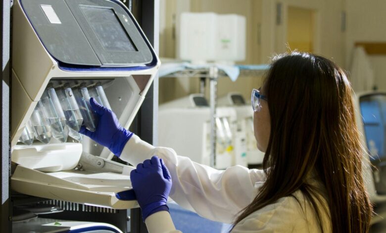 woman holding test tubes