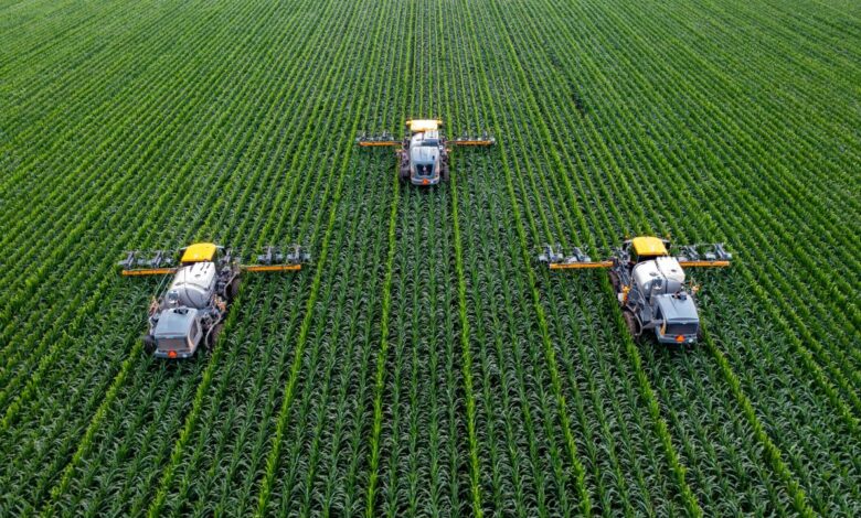 yellow and black heavy equipment on green field during daytime