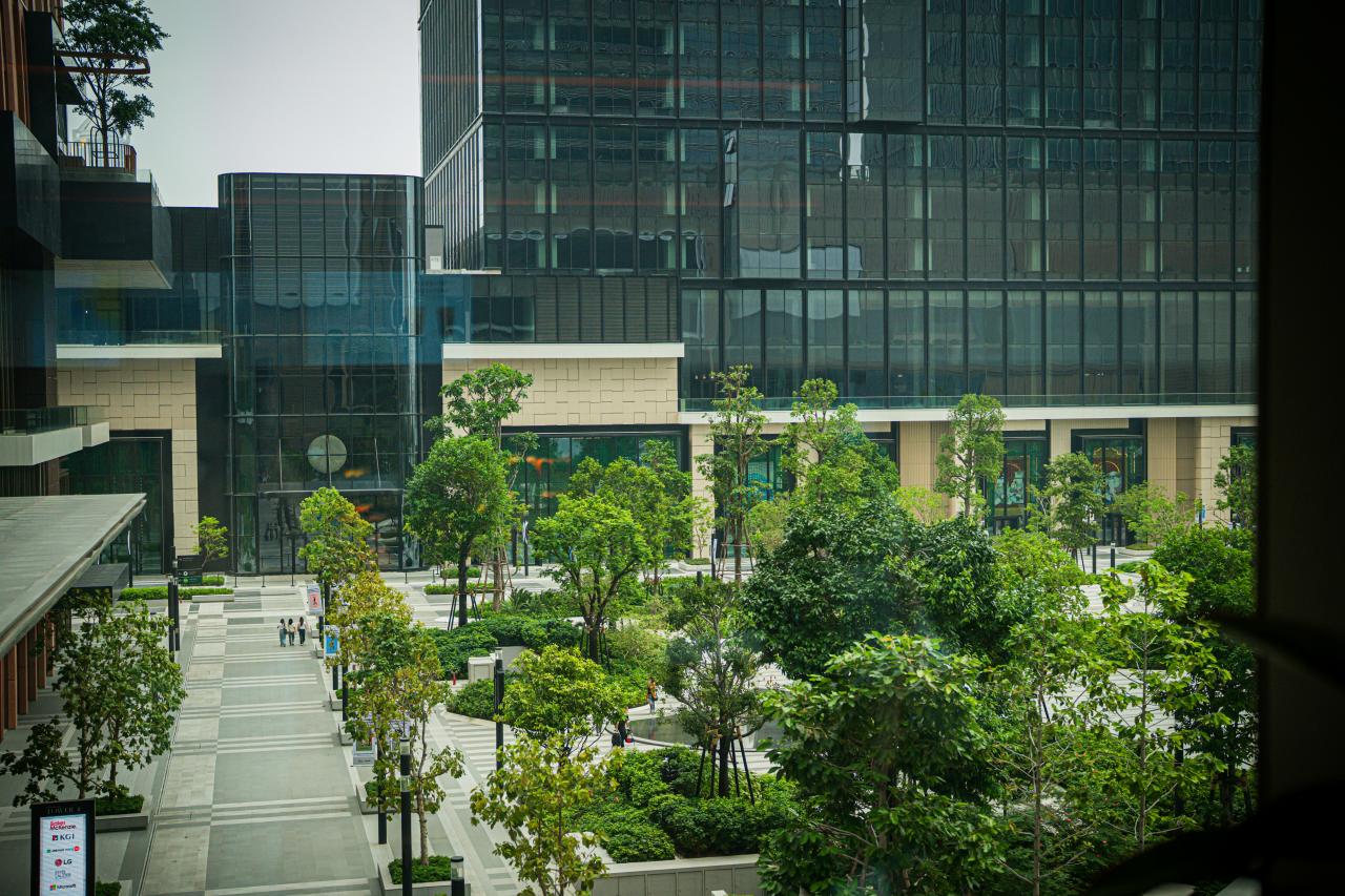 A modern building complex with green spaces.