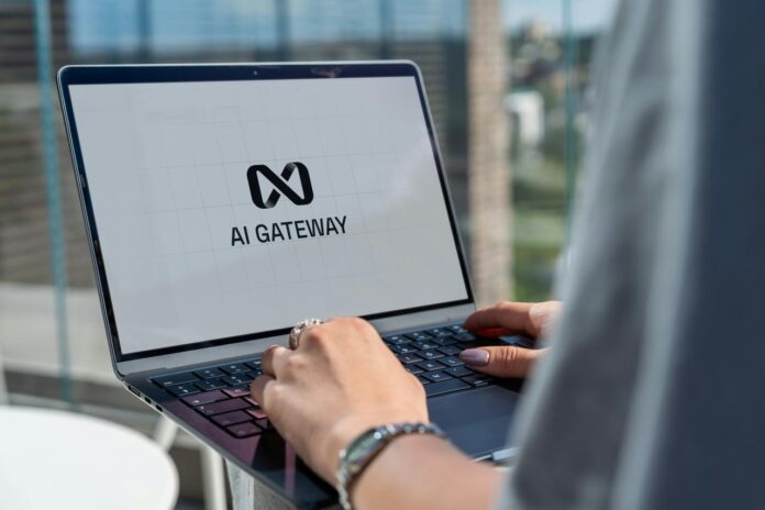 Person typing on laptop with ai gateway logo