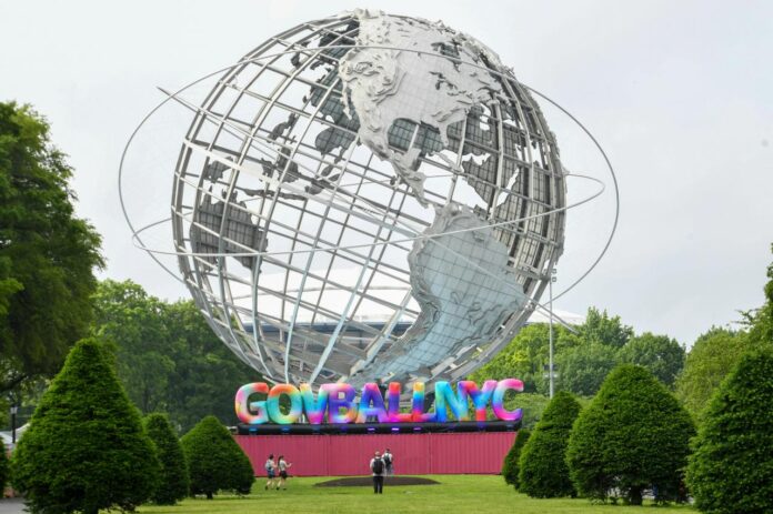 The unisphere sculpture stands in a park setting